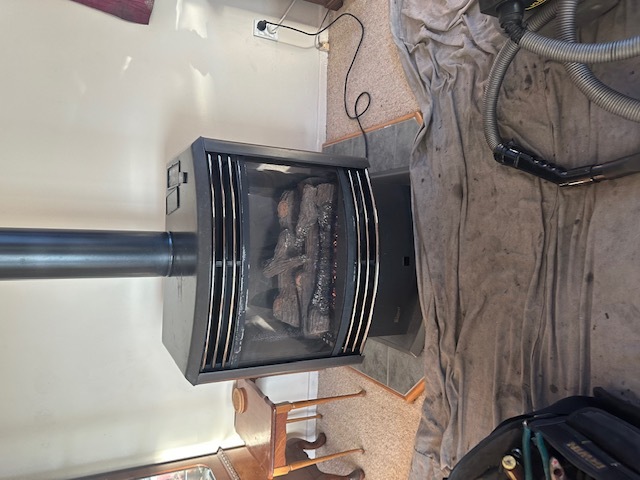 Gas Fire during service with drop sheet and vaccuum
