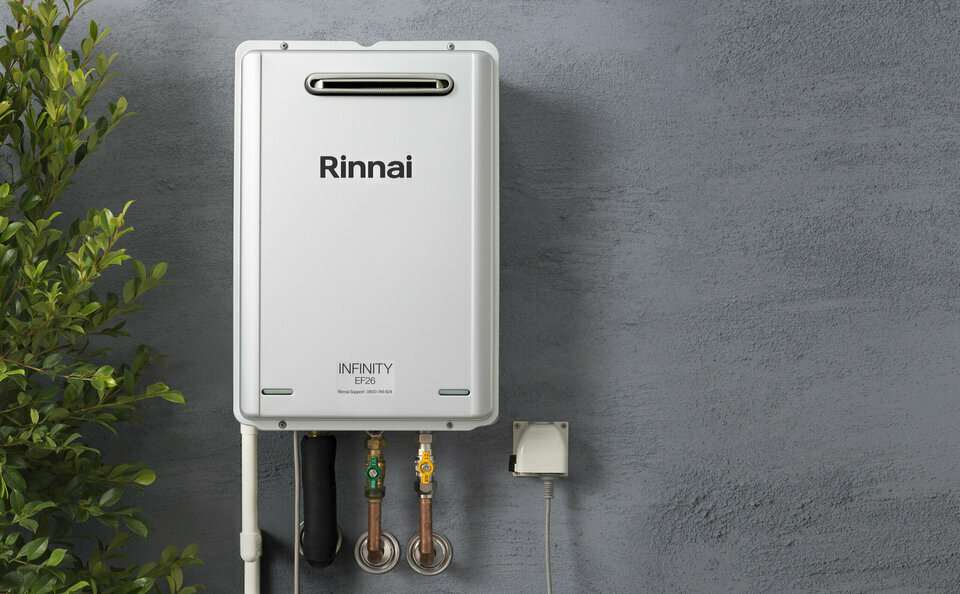 Rinnai infinity hot water unit on wall of house